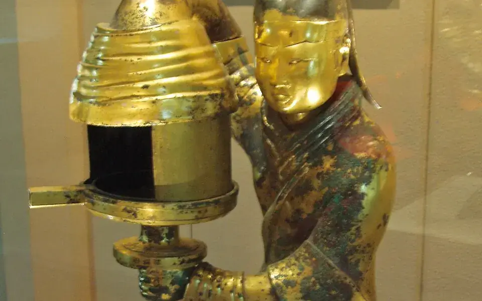A jade burial suit joined many small pieces with gold wire