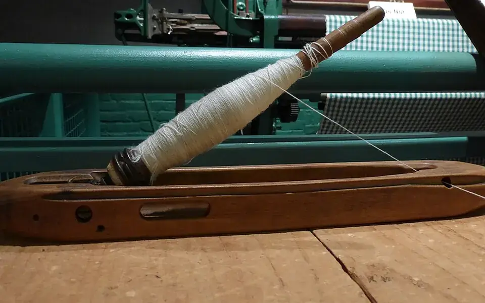 Shuttle and bobbin, illustrating textile technology
