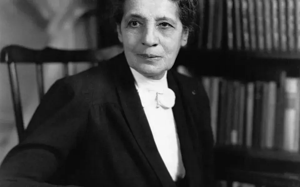 A historical photograph of physicist Lise Meitner.