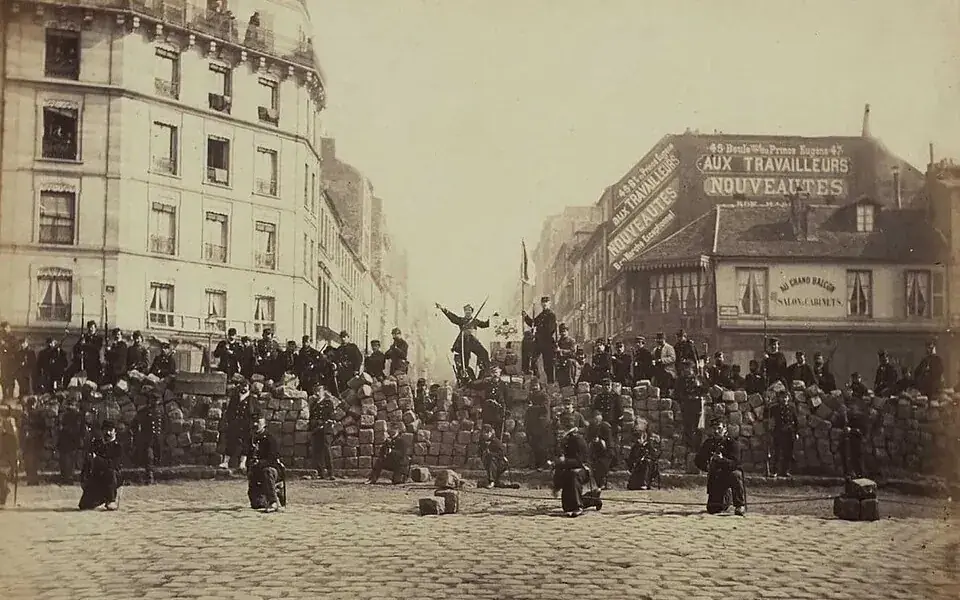 A photograph of a barricade associated with the Paris Commune in March 1871.