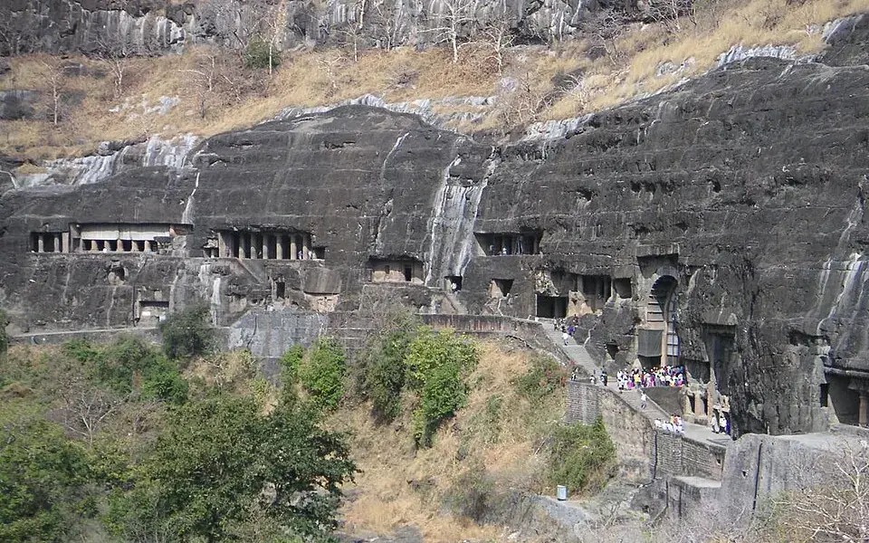 Rock-cut entrances along the cliff face at the Ajanta Caves