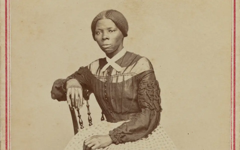 Harriet Tubman seated in a studio portrait made by Benjamin F. Powelson in the late 1860s