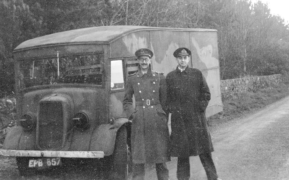 Charles Cholmondeley and Ewen Montagu beside the vehicle used for Operation Mincemeat in 1943