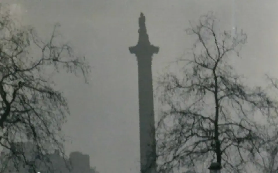 Nelson's Column in a foggy Trafalgar Square in December 1952