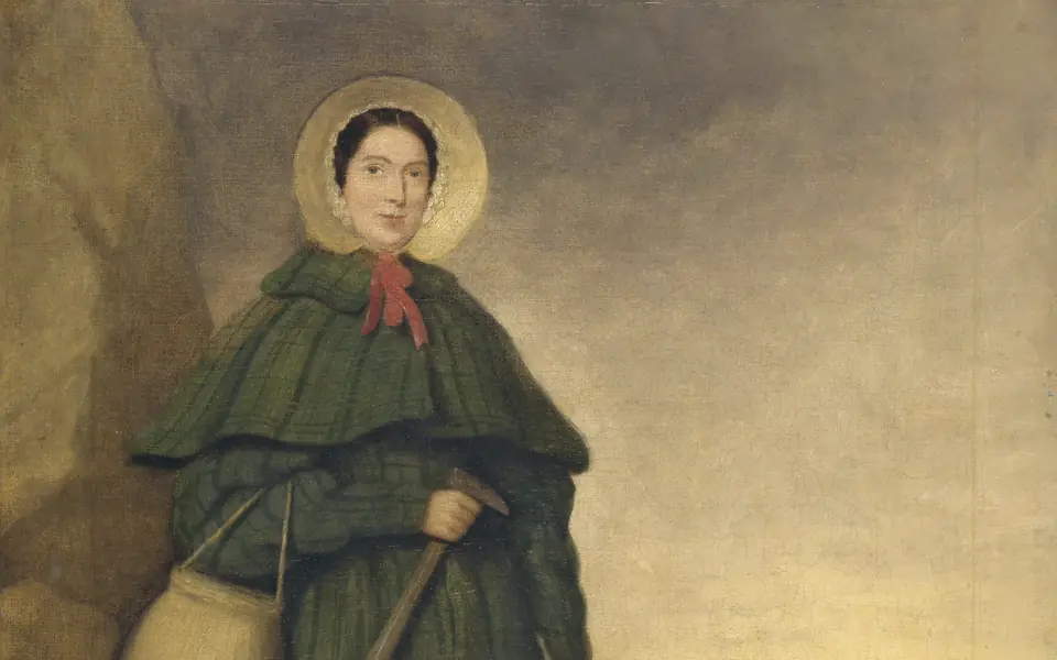 Portrait detail showing Mary Anning in a bonnet and cloak, with the Dorset coast behind her