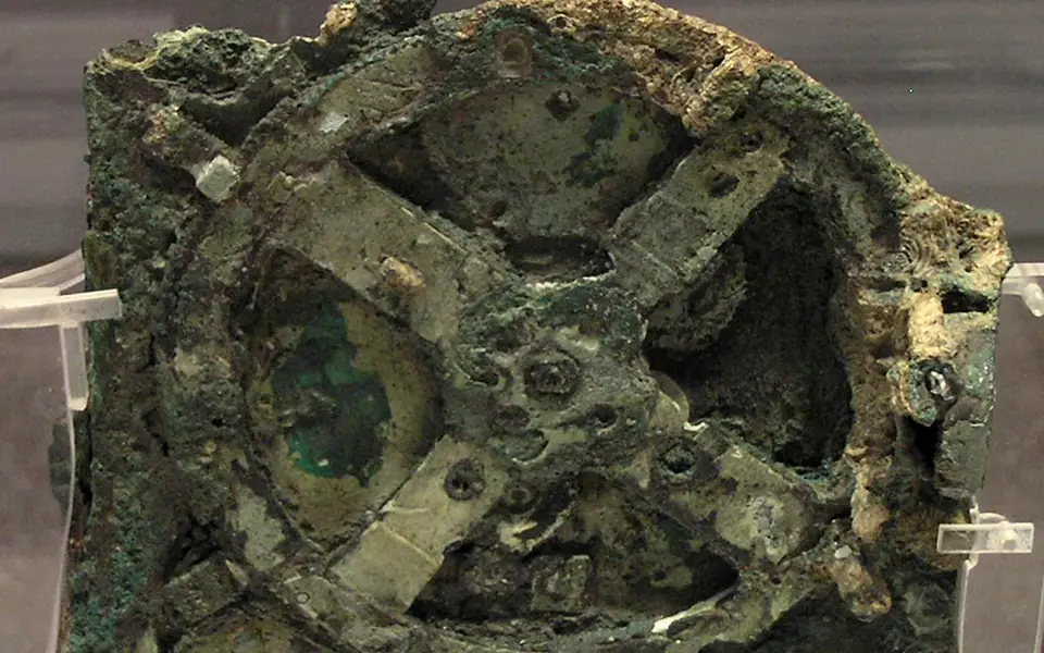 Detail of the corroded bronze gears in a surviving fragment of the Antikythera mechanism in Athens