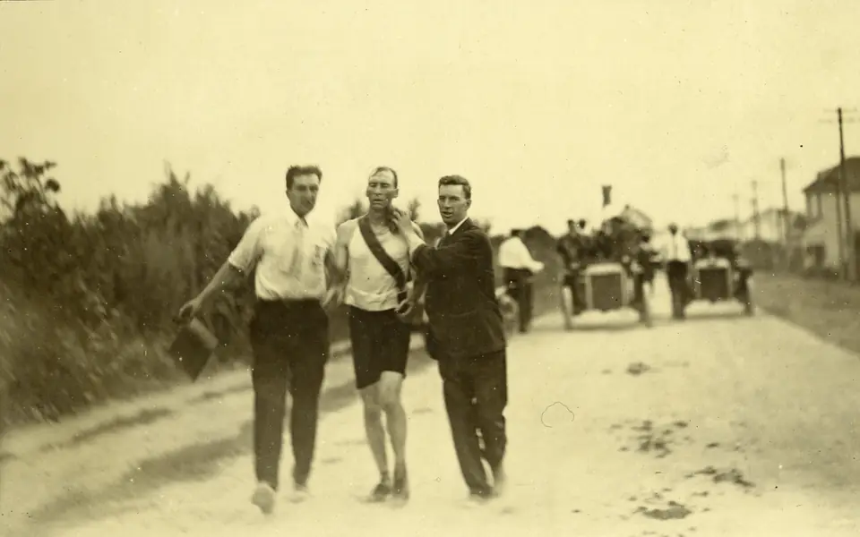 Thomas Hicks being sponged and supported by attendants during the 1904 St. Louis Olympic marathon, photographed by Jessie Tarbox Beals