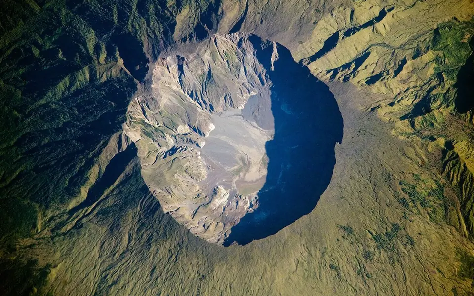 Tambora's caldera photographed from the International Space Station on June 3, 2009; a modern view of the volcano altered by the 1815 eruption