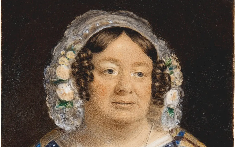 Detail of Sarah Biffin’s self-portrait from the early 1840s, showing her face, floral bonnet and embroidered collar